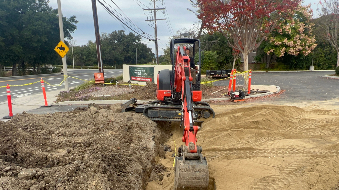 A construction site with a large pile of dirt